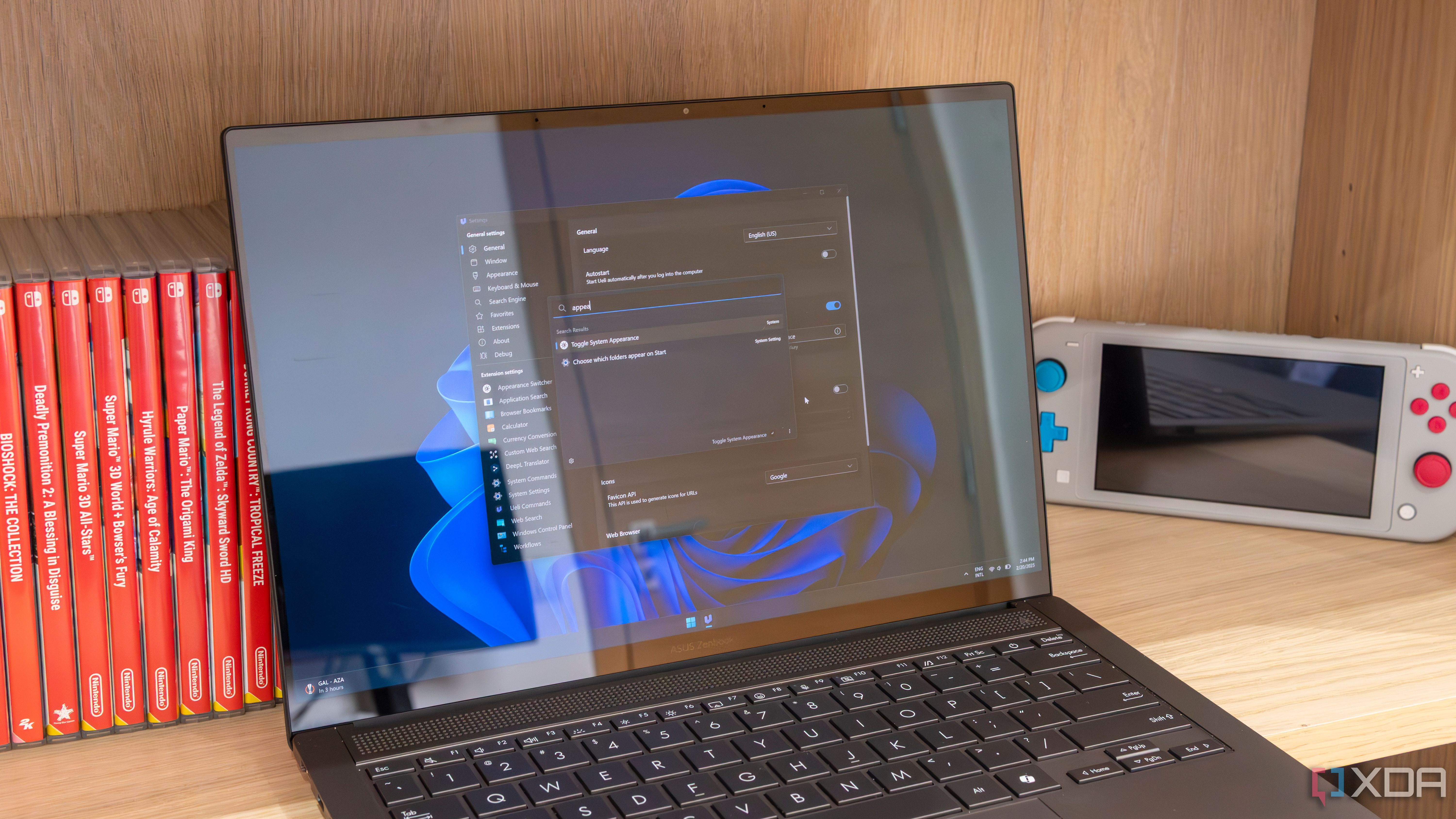 A Windows 11 laptop showing the Ueli settings window and search bar