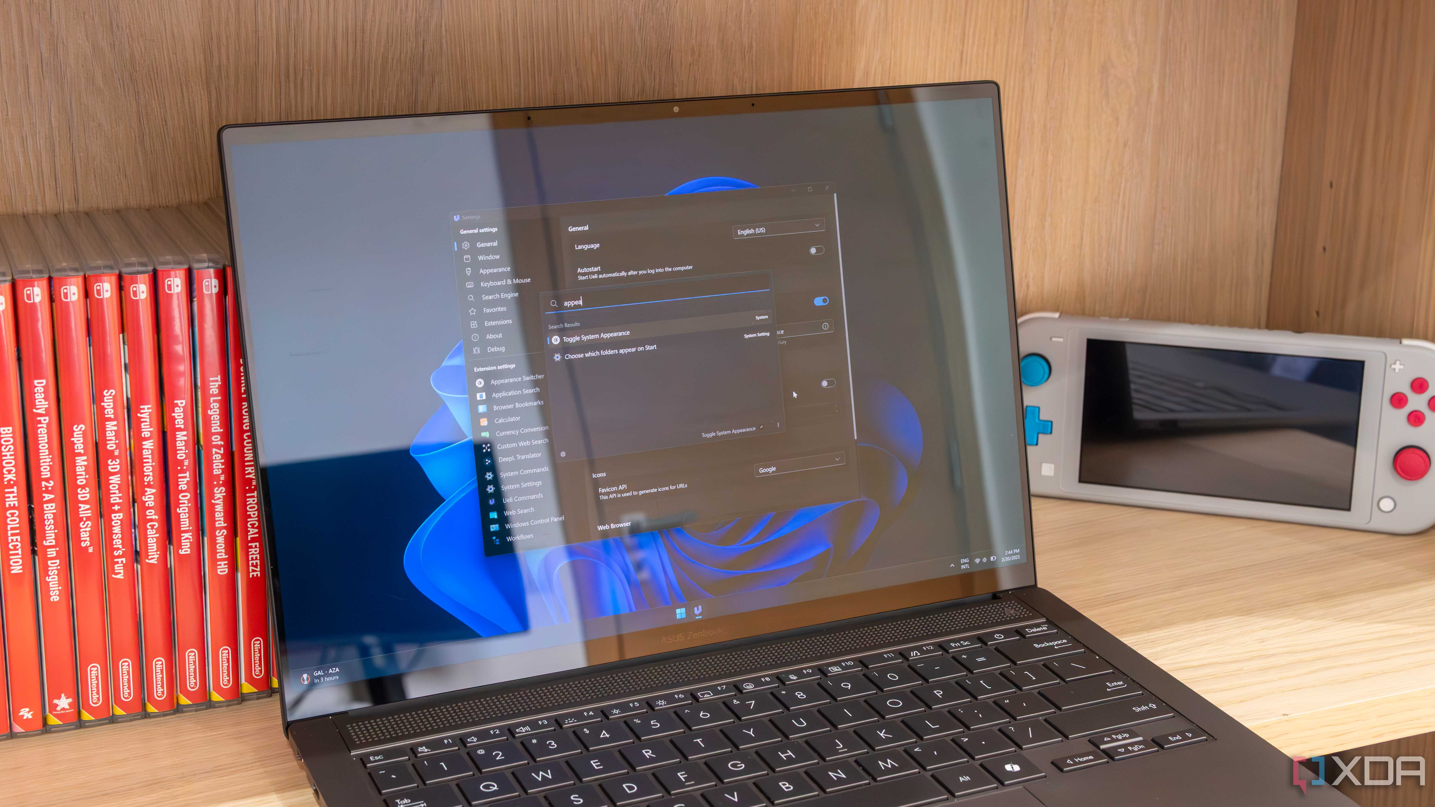 A Windows 11 laptop showing the Ueli settings window and search bar