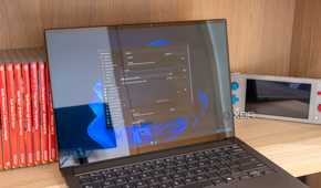 A Windows 11 laptop showing the Ueli settings window and search bar