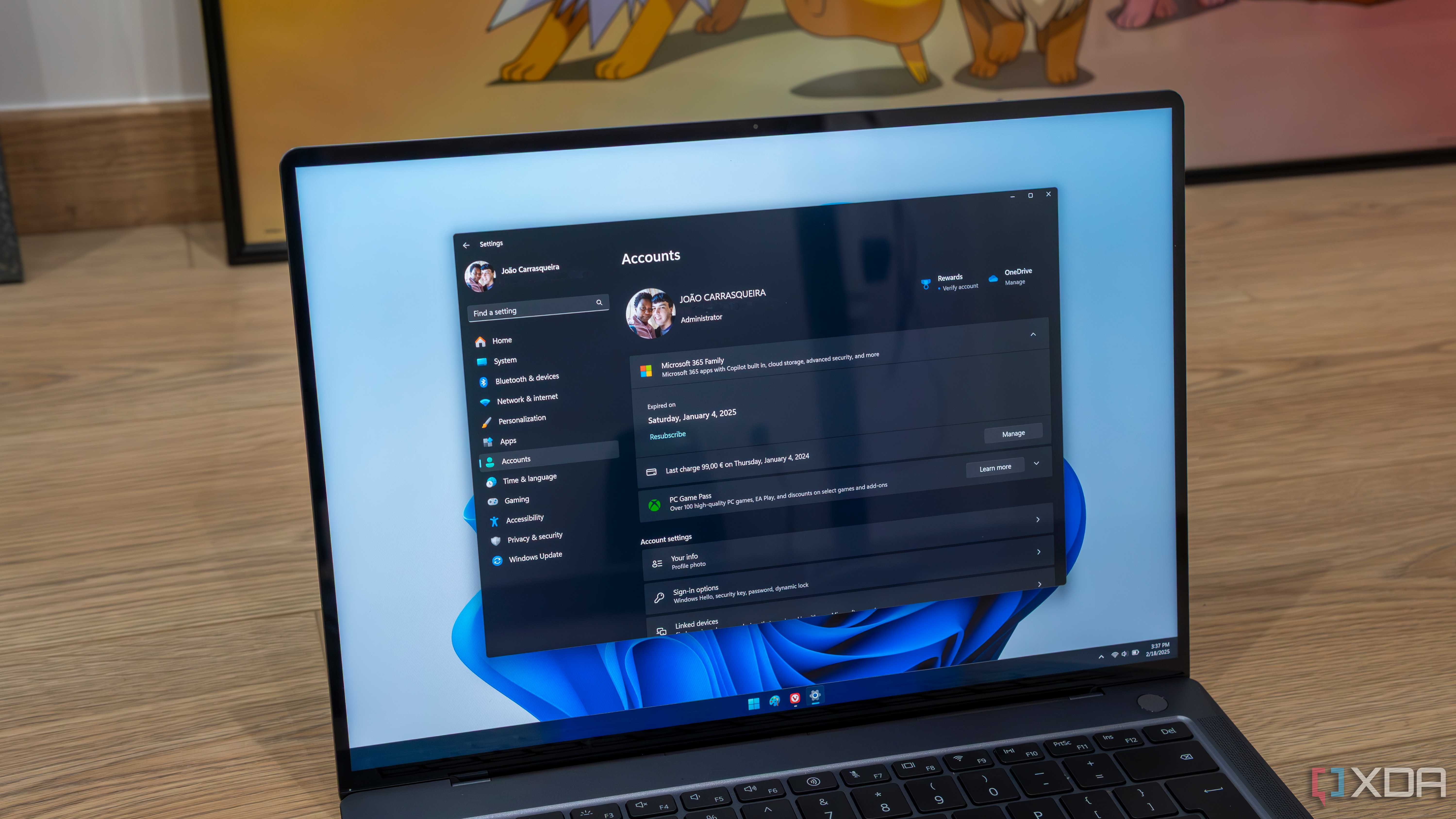 A Windows 11 laptop showing Microsoft account information in the Settings app