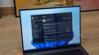 A Windows 11 laptop showing Microsoft account information in the Settings app
