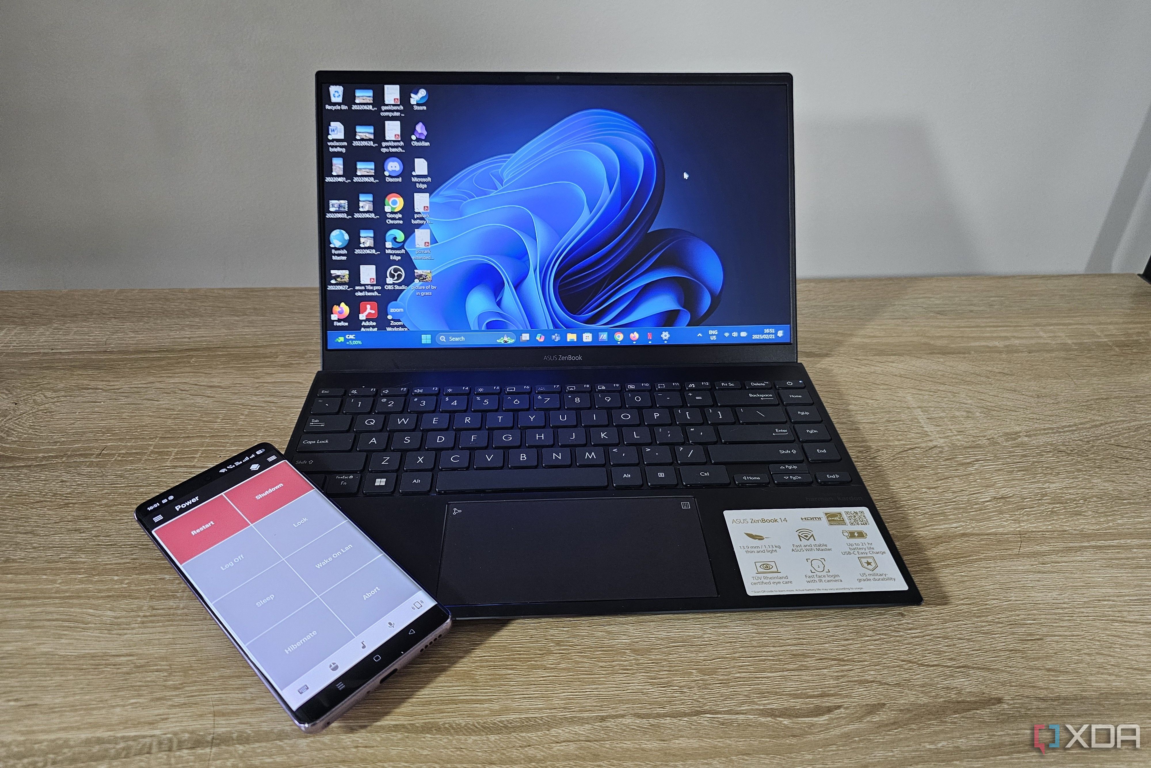 windows 11 laptop with power options on smartphone with unified remote