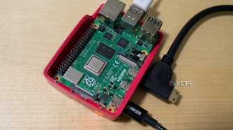 The Raspberry Pi 4 inside its case with the Micro HDMI and USB-C connected.