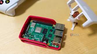 A toy cat figurine lifting the lid to expose the raspberry Pi inside a case.