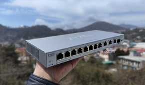 A person holding a Zyxel network switch
