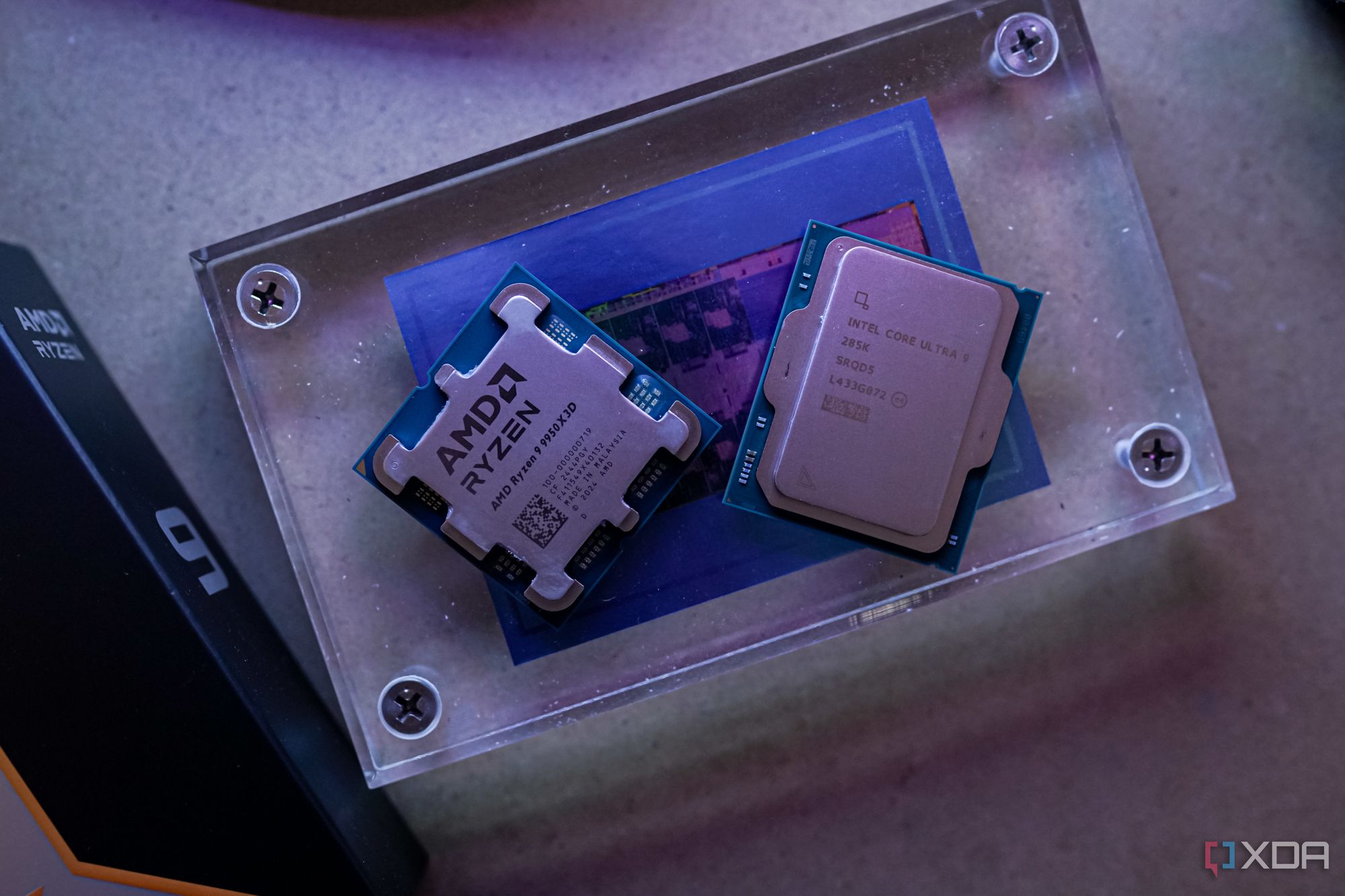 The Ryzen 9 9950X3D and Core Ultra 9 285K sitting next to each other. 