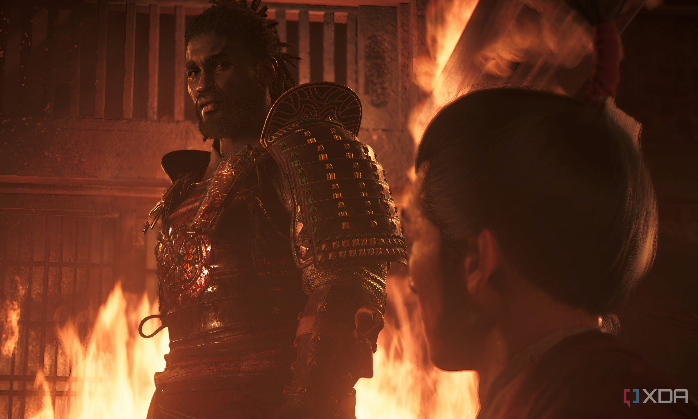 An image from Assasin's Creed Shadows, showing Yasuke the Samurai in a fiery room.