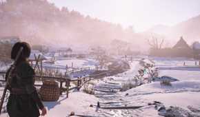 A screenshot from Assassin's Creed Shadows, showing a snow-covered village.