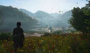 A screenshot from Assassin's Creed Shadows, showing Naoe standing in a beautiful grassland overlooking a valley.