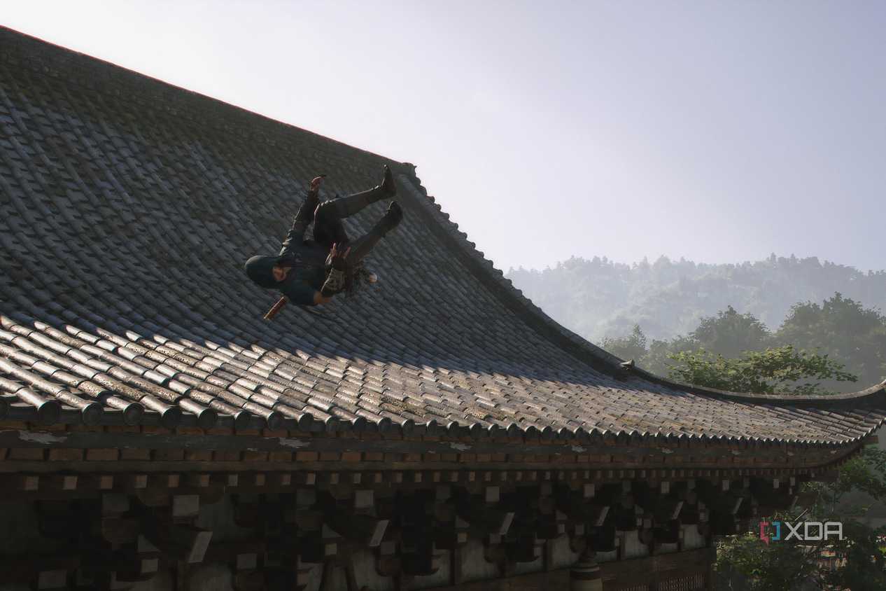 A screenshot from the game Assassin's Creed Shadows, showing Naoe, the protagonist, somersaulting off a building.