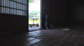 A screenshot from Assassin's Creed Shadows, showing Naoe, the female protagonist, crouching in the shadows.