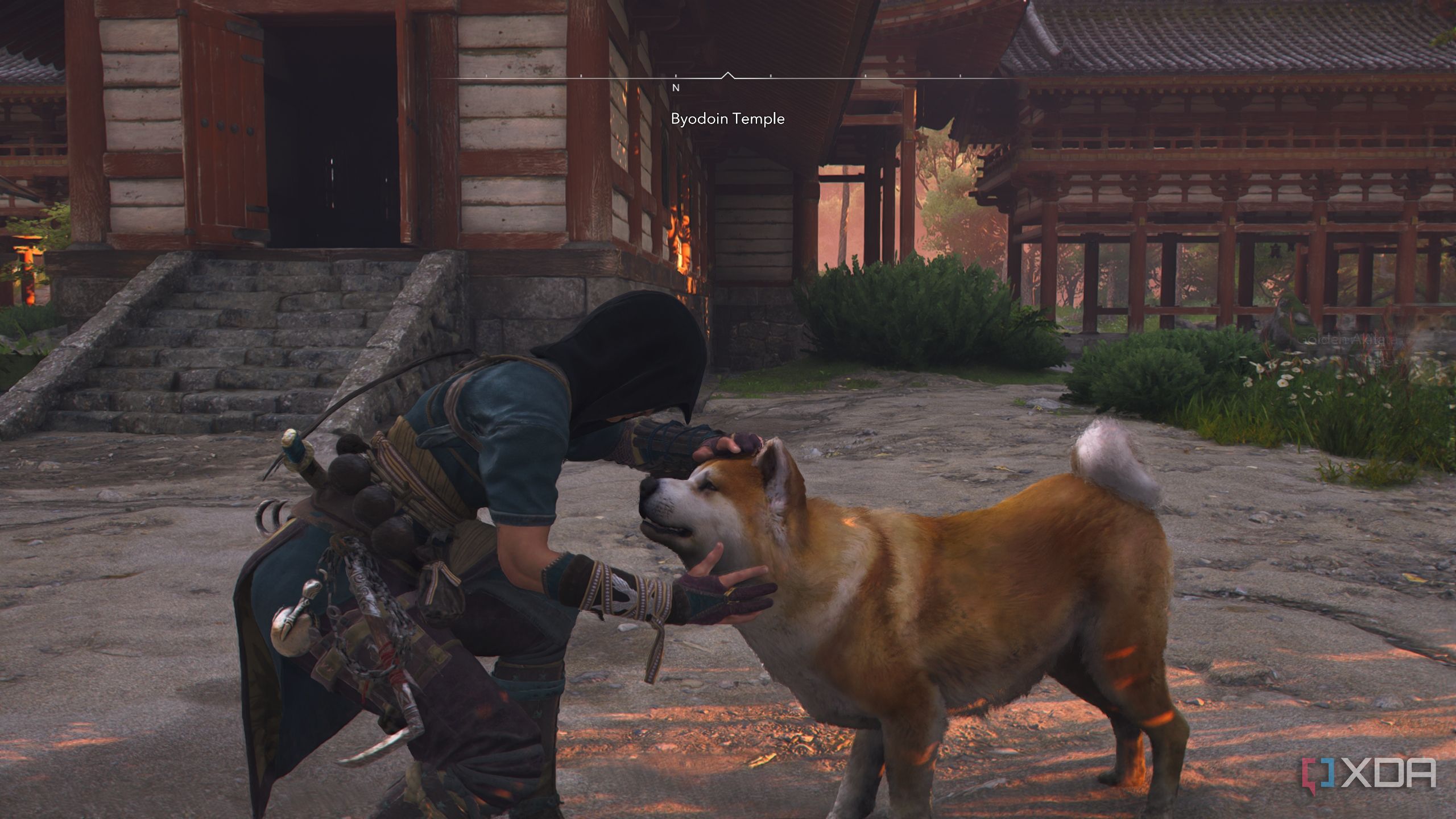 A screenshot from Assassin's Creed Shadows, showing Naoe, the female protagonist, petting a brown dog.
