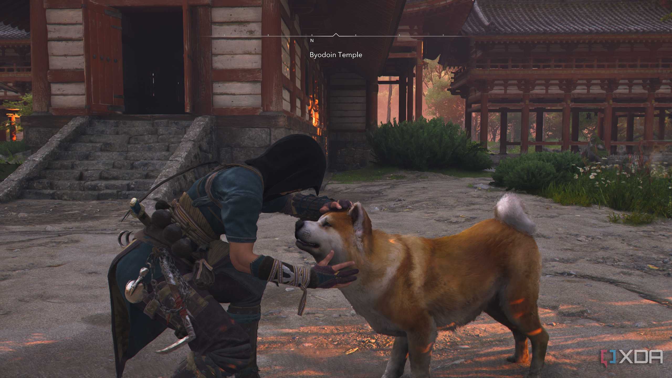 A screenshot from Assassin's Creed Shadows, showing Naoe, the female protagonist, petting a brown dog.
