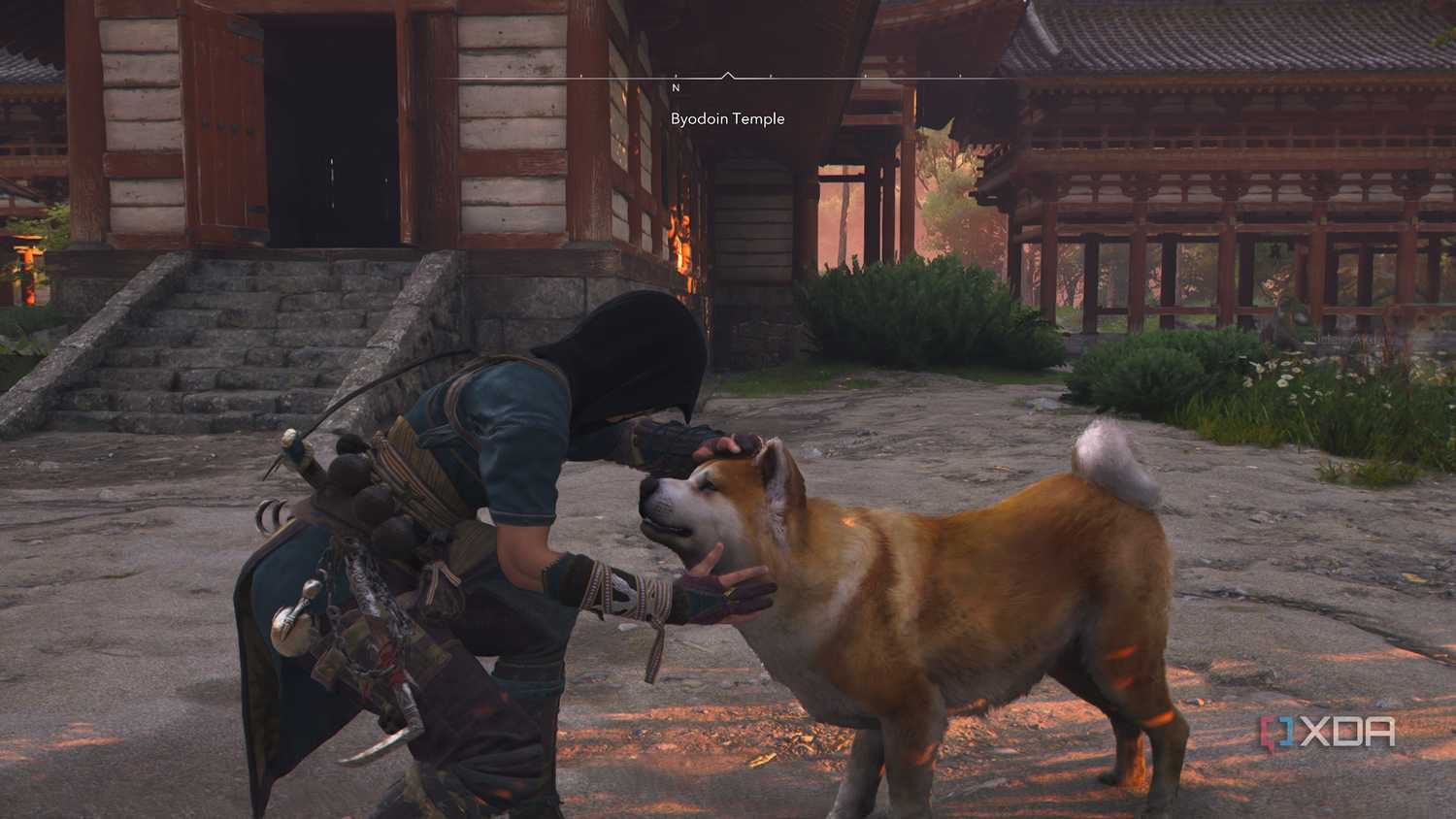 A screenshot from Assassin's Creed Shadows, showing Naoe, the female protagonist, petting a brown dog.