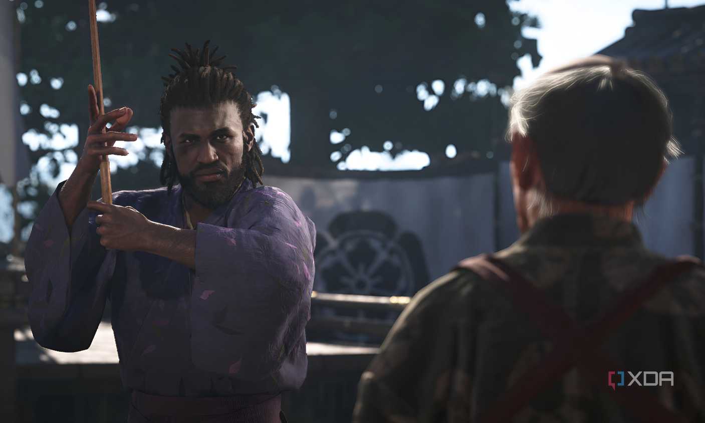 A screenshot from Assassin's Creed Shadows, showing Yasuke, the protagonist, holding a wooden sword or bokken.