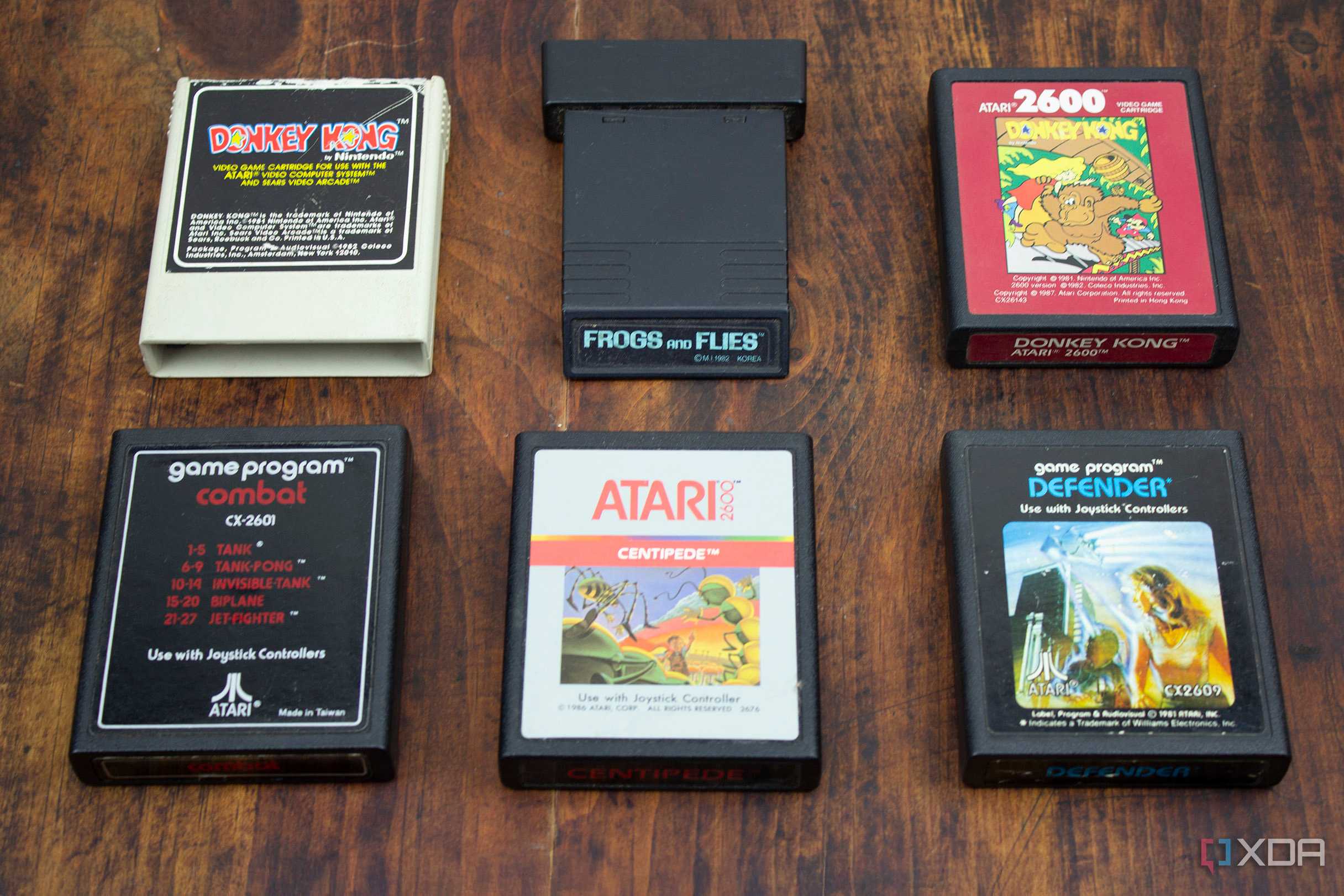 Atari and Coleco games on a wood table