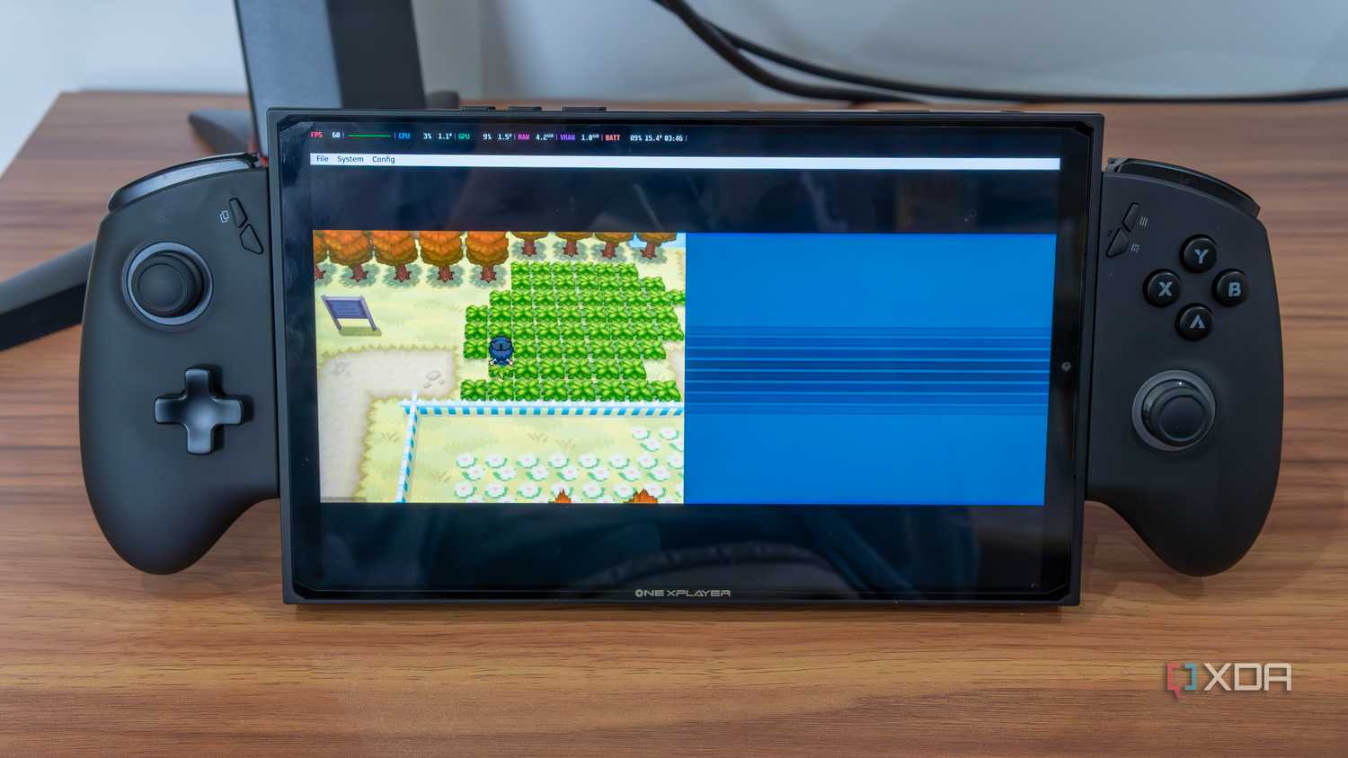 A gaming handheld running a Nintendo DS emulator in Bazzite