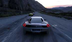 An image from the 2014 game Driveclub, showing a silver Ferrari racing on a mountain road.