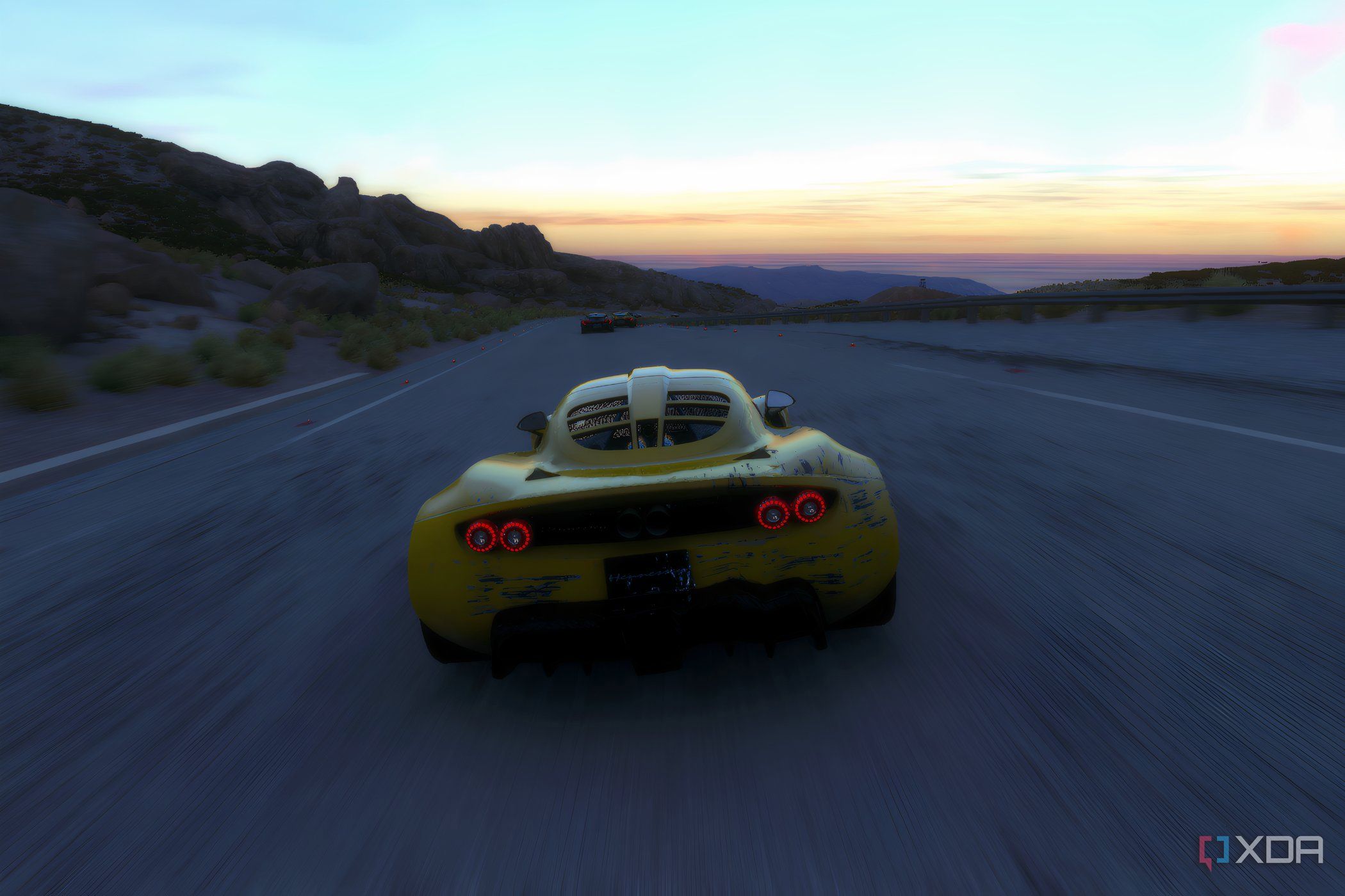 An image from the 2014 game Driveclub, showing a yellow Henessey Venom GT from the rear.