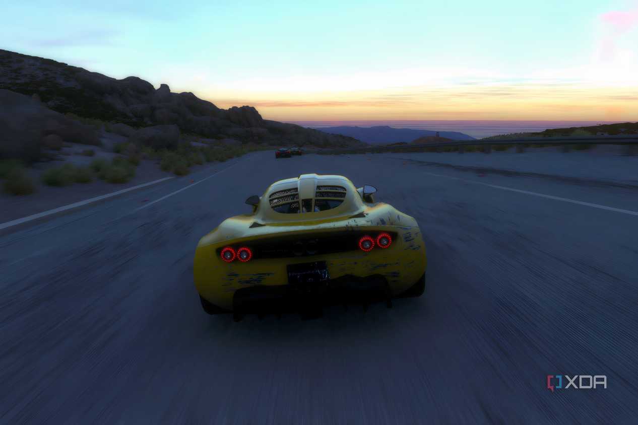An image from the 2014 game Driveclub, showing a yellow Henessey Venom GT from the rear.