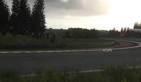 An image from the 2014 game Driveclub, showing a sunlit winding track with grass fields around it.