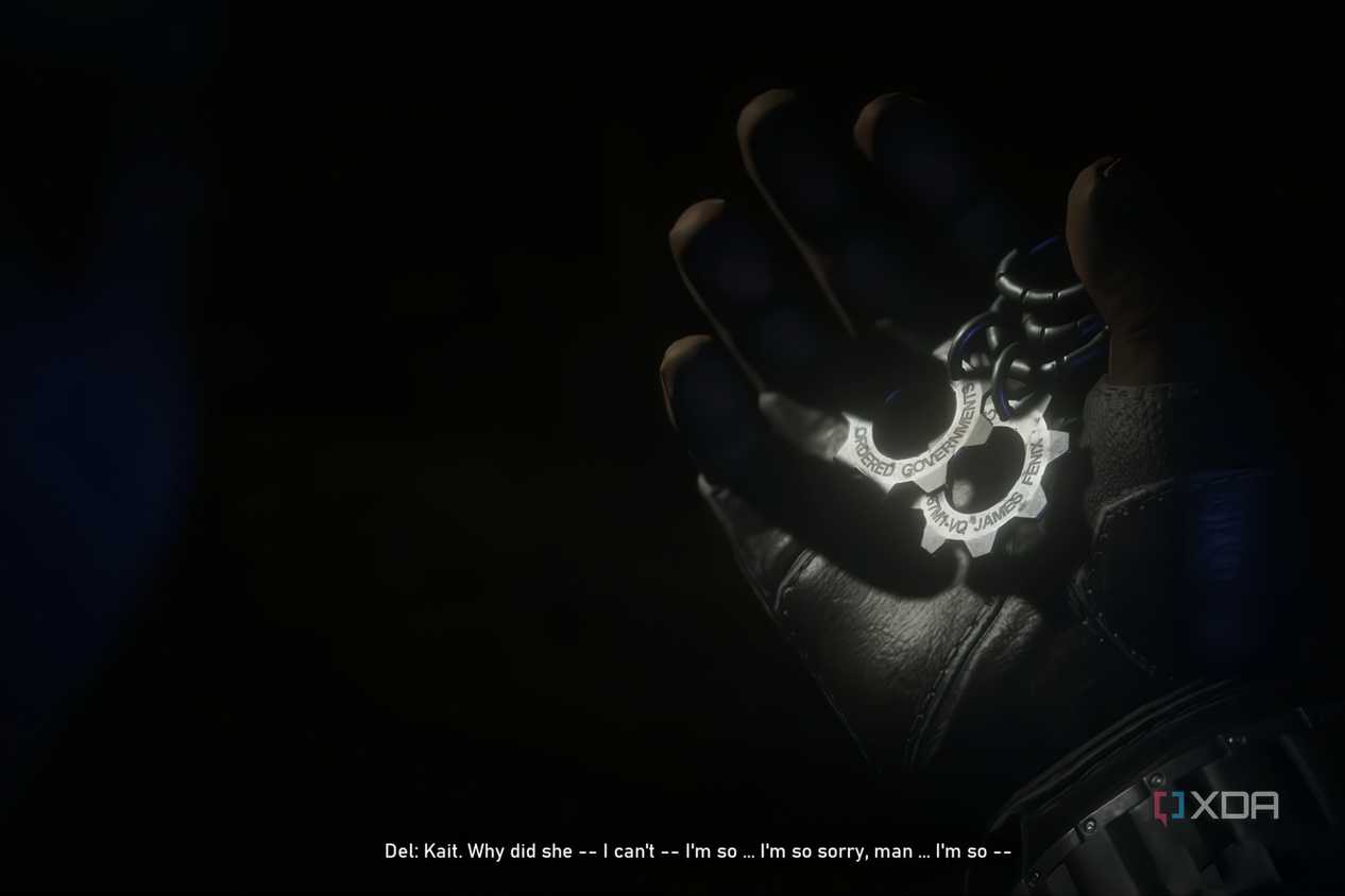 A screenshot from the game Gears 5, showing gear-shaped COG tags being held in a gloved hand.