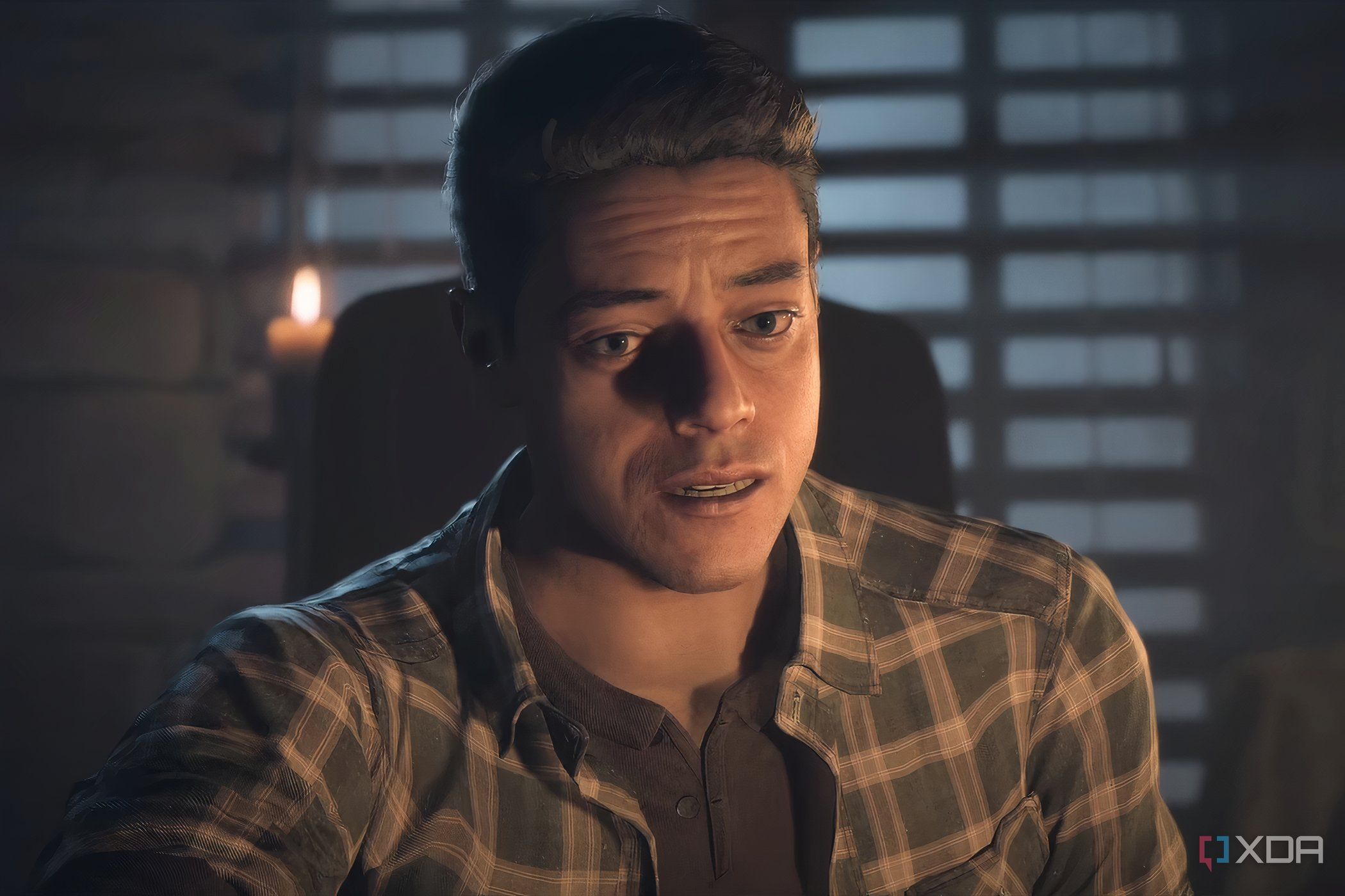A screenshot from the game "Until Dawn", showing a man lit in candle light.
