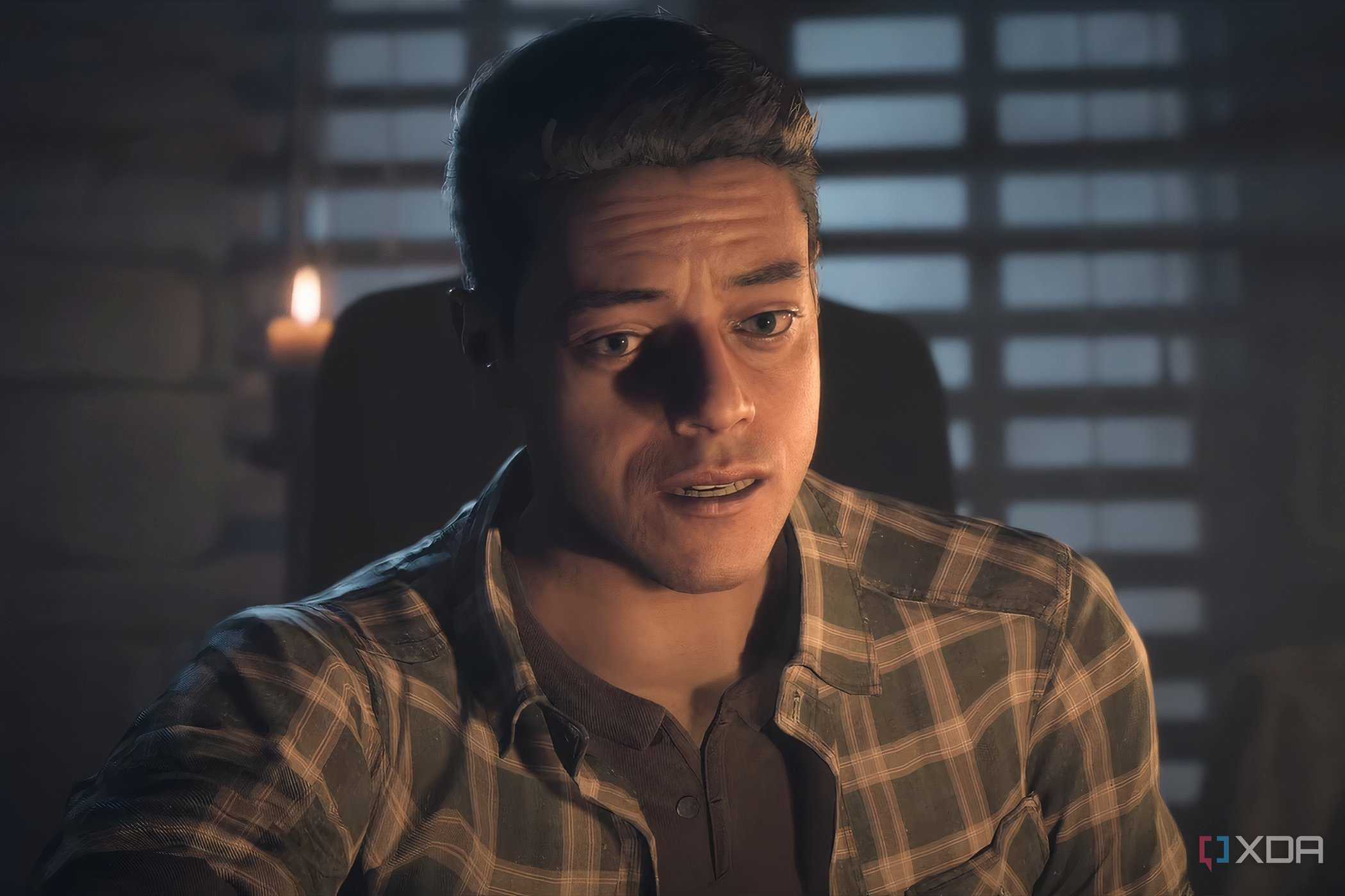 A screenshot from the game "Until Dawn", showing a man lit in candle light.