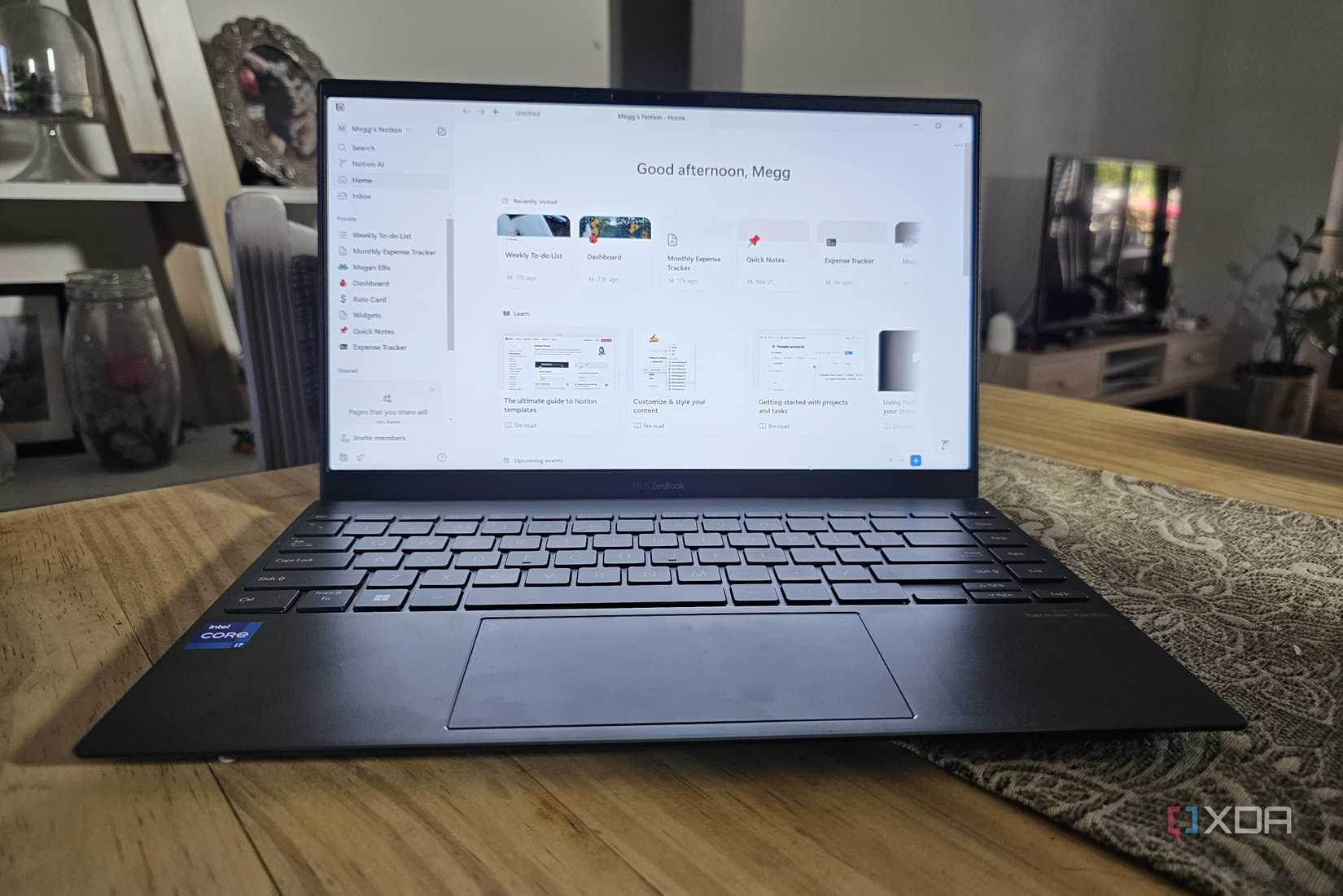 a laptop on a table with notion on the screen