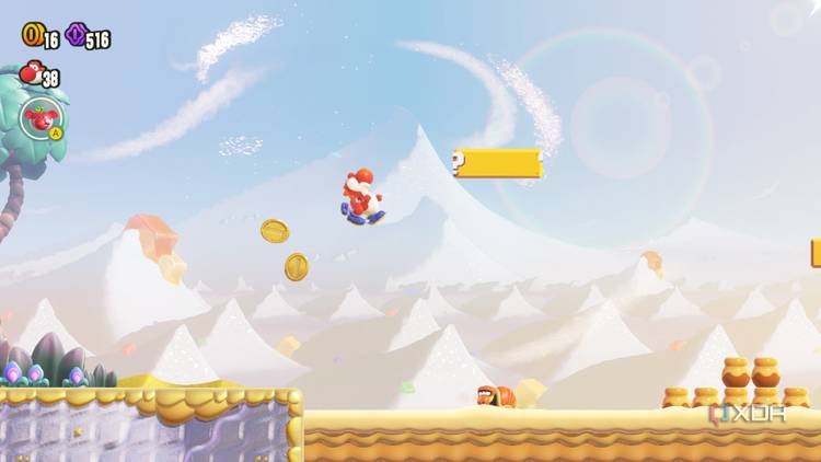 Red Yoshi jumping in desert level Super Mario Brothers Wonder