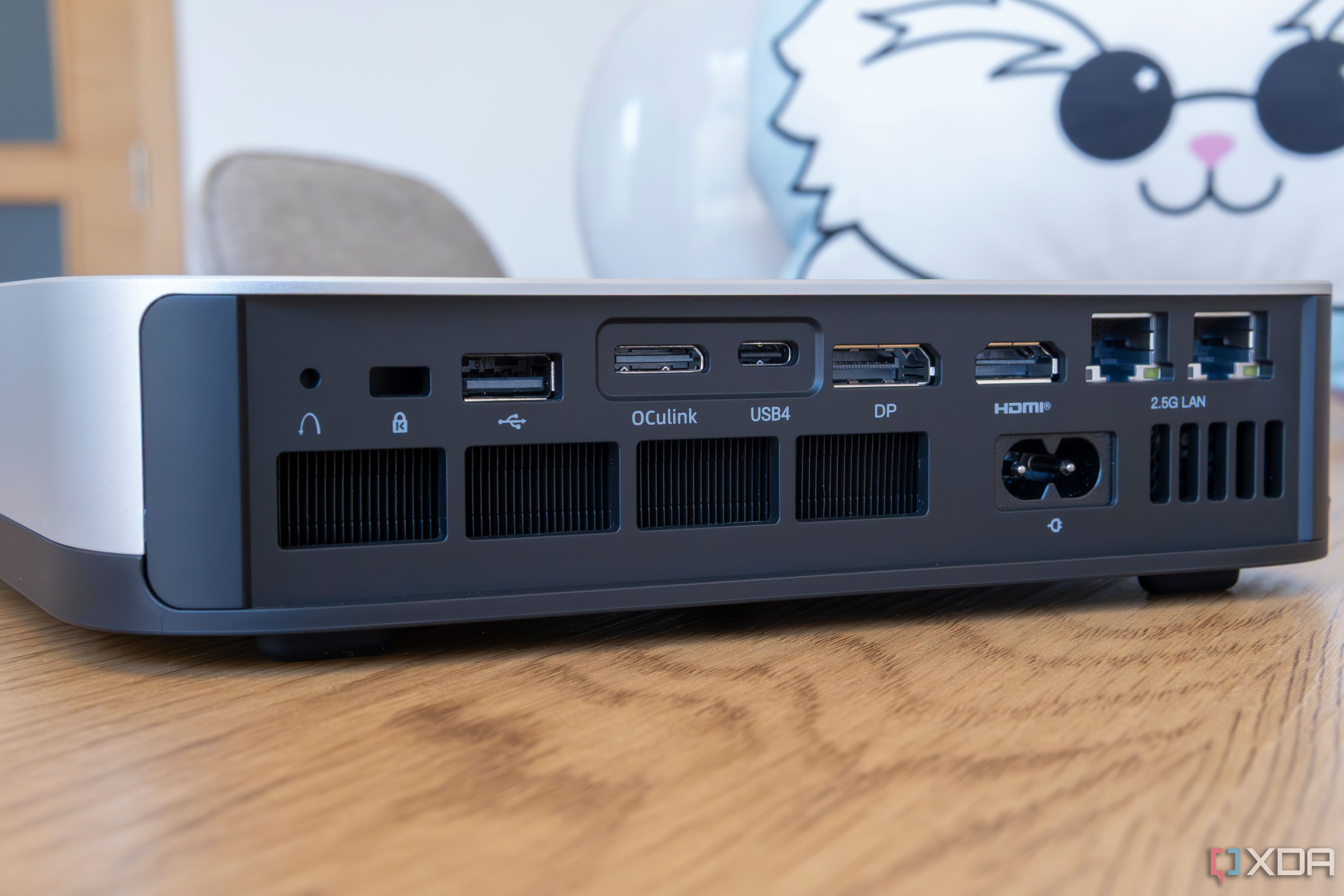 Close-up of the ports and buttons on the rear of the Minisforum AI X1 Pro