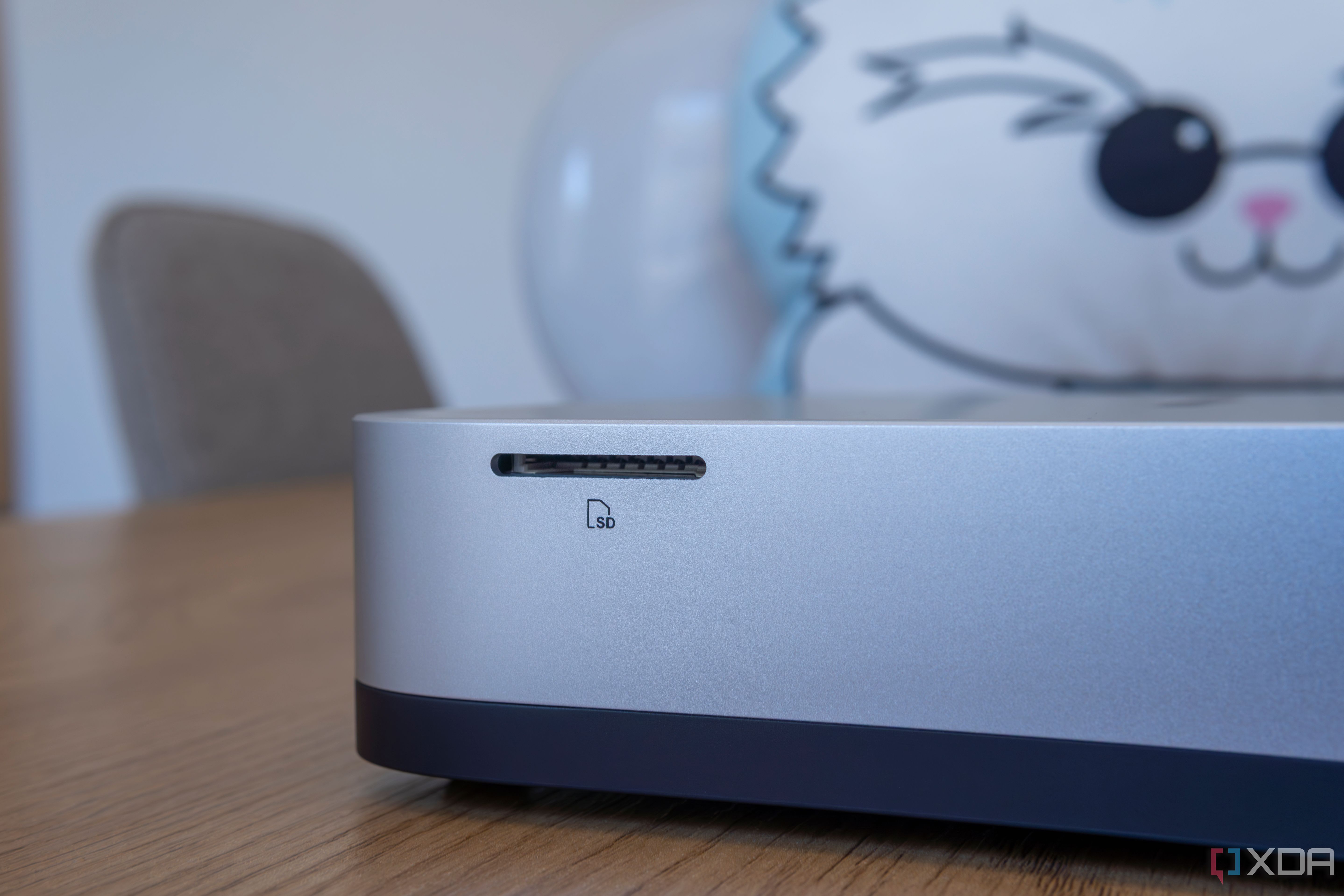 Close-up of the SD card slot on the side of the Minisforum AI X1 Pro