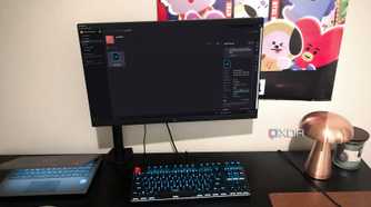 Mudstack cloud storage tool displayed on desktop PC, with lamp, chromebook, and poster in view