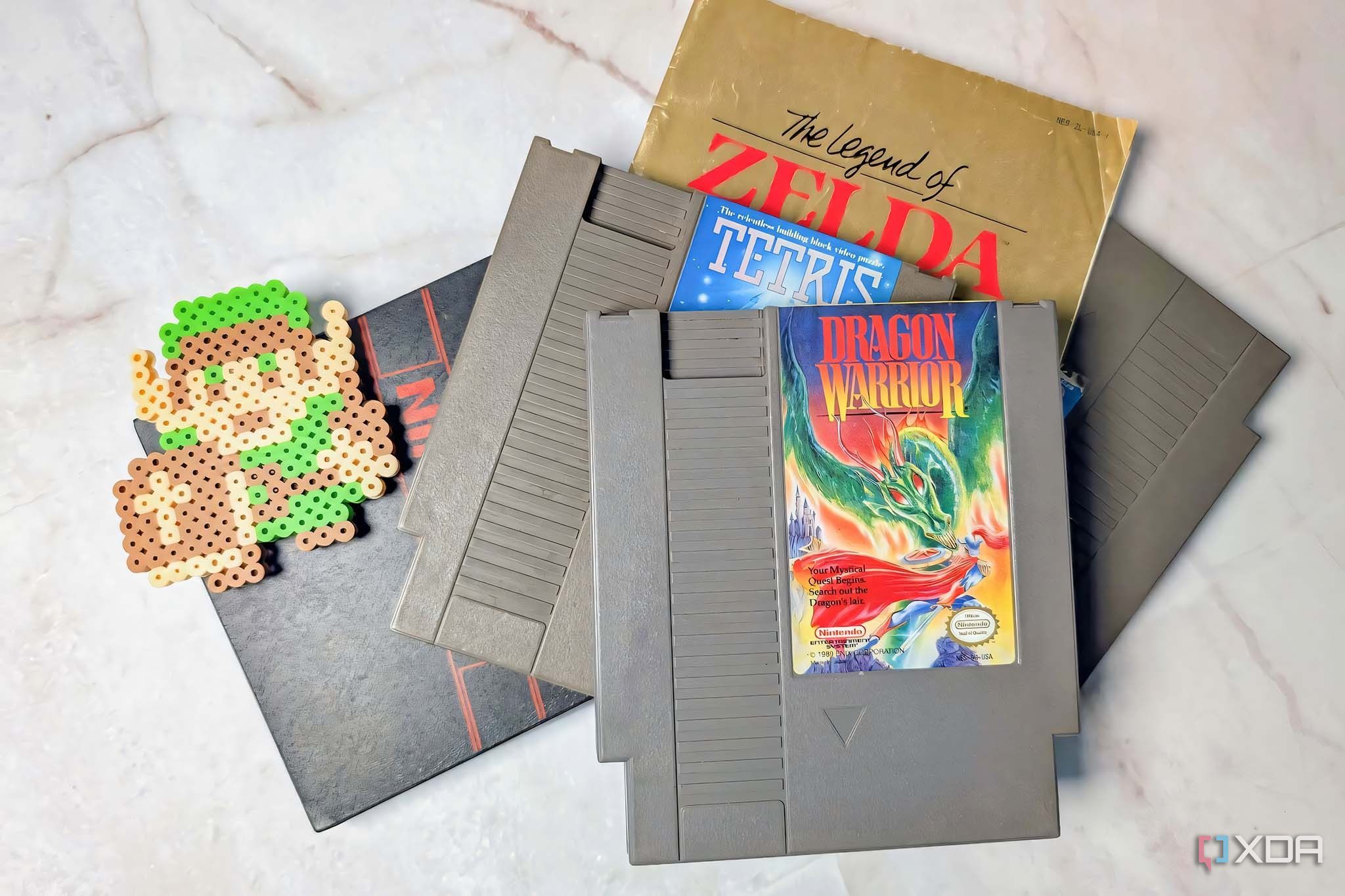 NES game cartridges stacked with Legend of Zelda icon