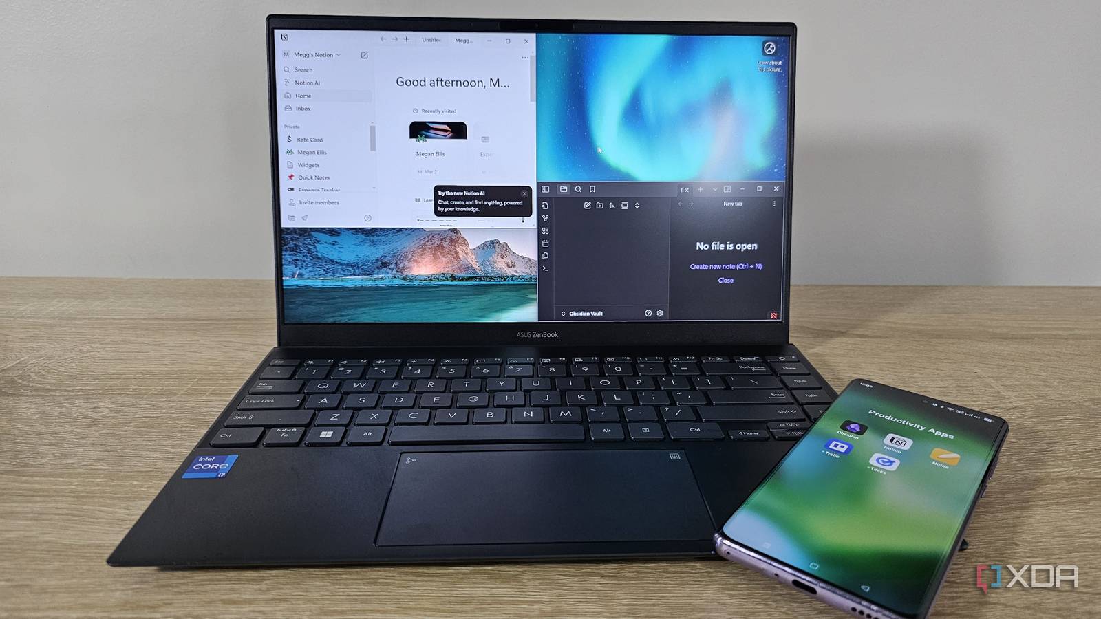notion and obsidian open on a laptop with a phone showing productivity app icons