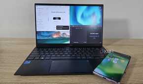 notion and obsidian open on a laptop with a phone showing productivity app icons