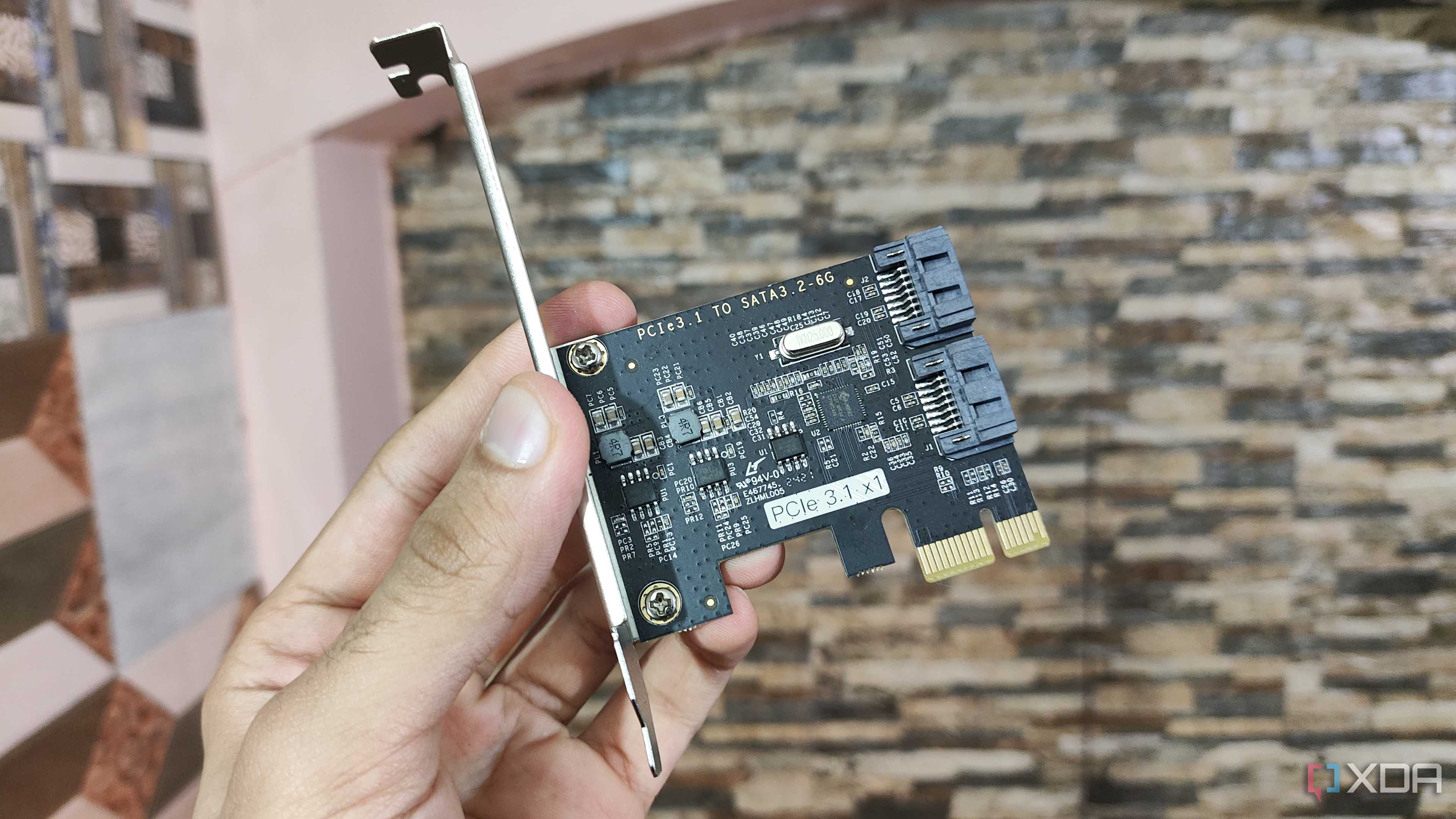 A person holding a PCIe-to-USB card