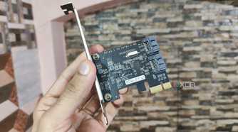 A person holding a PCIe-to-USB card