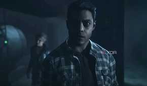 A screenshot from the game "Until Dawn", showing a man in a flannel shirt.