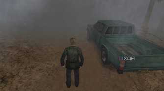An in-game screenshot from the game Silent Hill 2, showing a man standing next to a green pickup truck while standing on a dirt road.