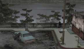An in-game screenshot from the game Silent Hill 2, showing a large lake, a parking lot, and a blue coupe.