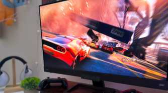 An image of a car-racing video game on a monitor.