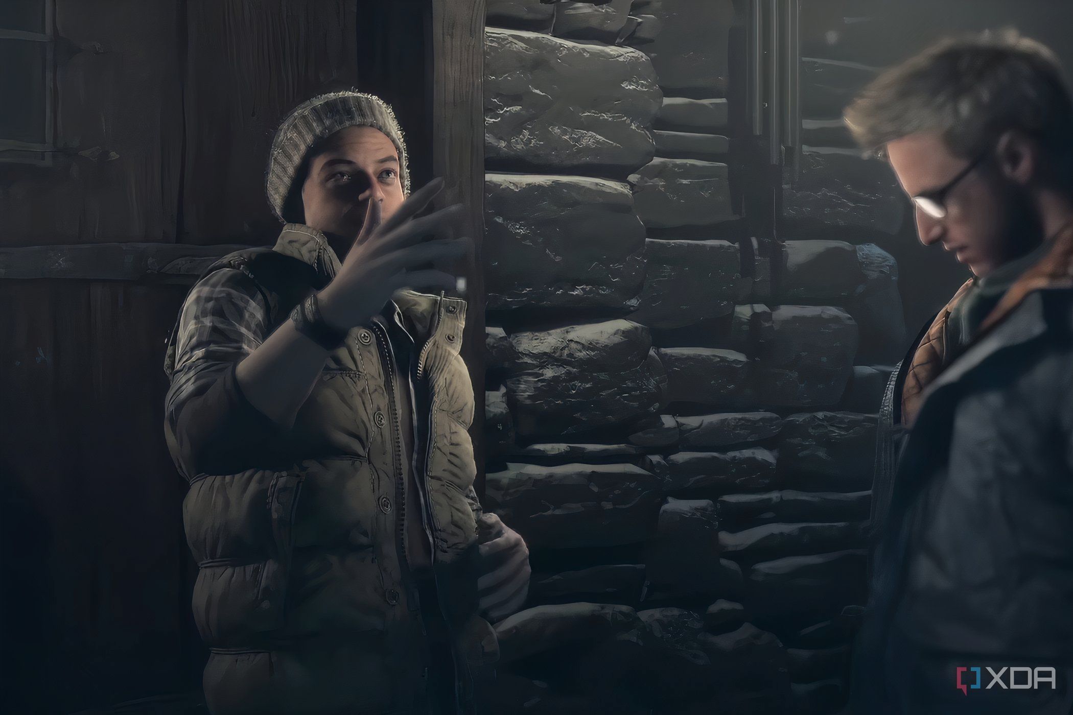 A screenshot from the game "Until Dawn", showing two characters in heavy woollen clothing.