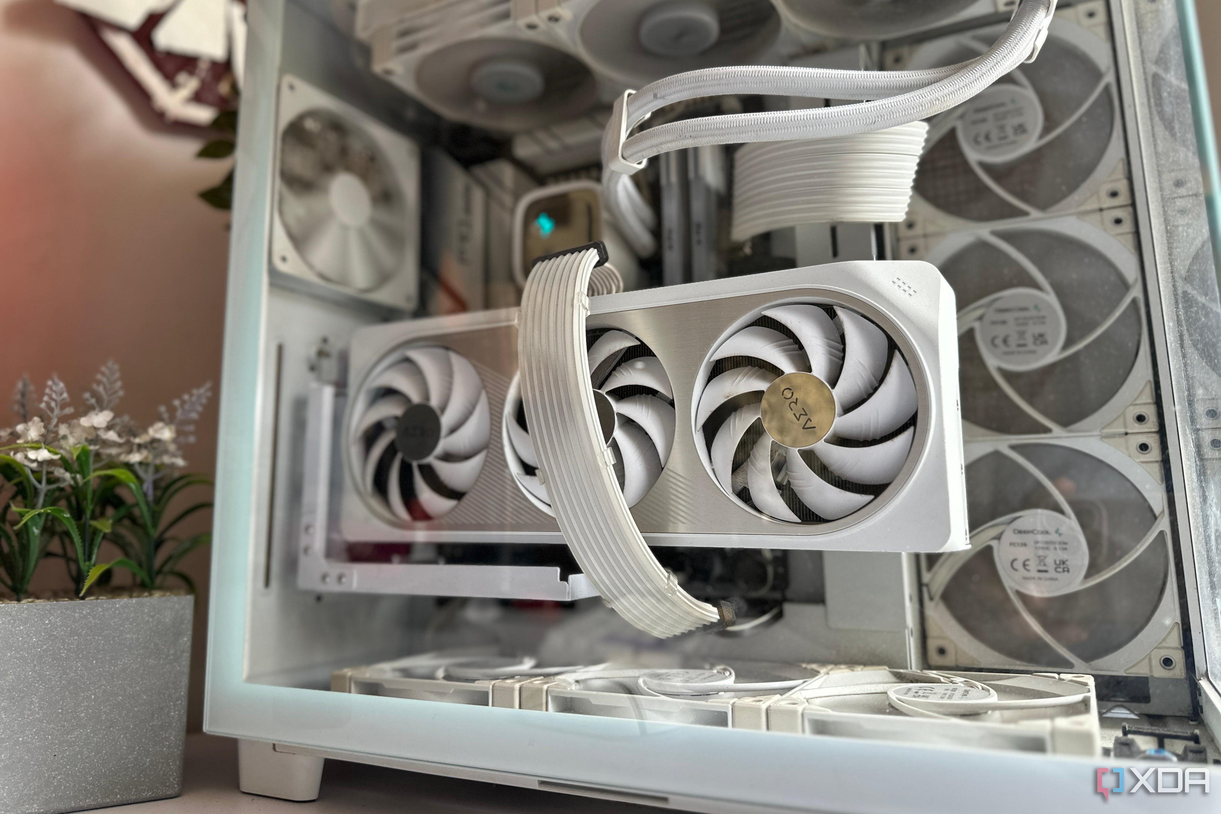 A white themed gaming PC with a white GPU in focus on a desk