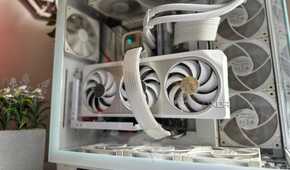 A white themed gaming PC with a white GPU in focus on a desk