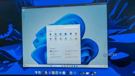 Close-up os a monitor displaying the macOS desktop with Parallels Desktop running Windows 11