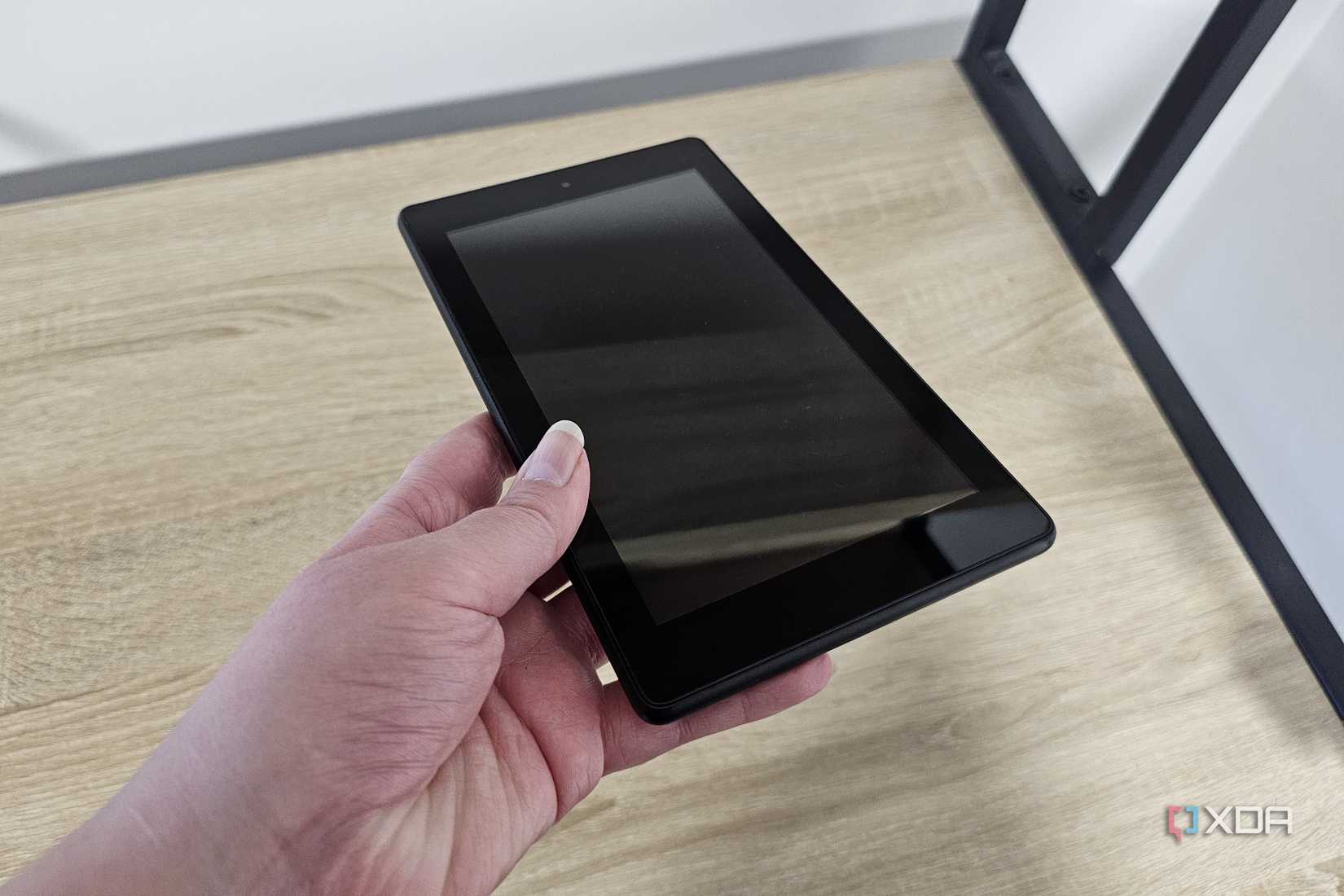 a fire tablet held in someone's hand