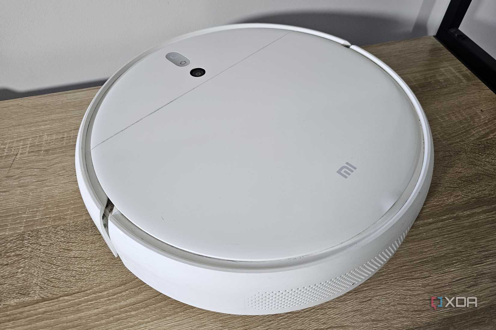a xiaomi robot vacuum on a table