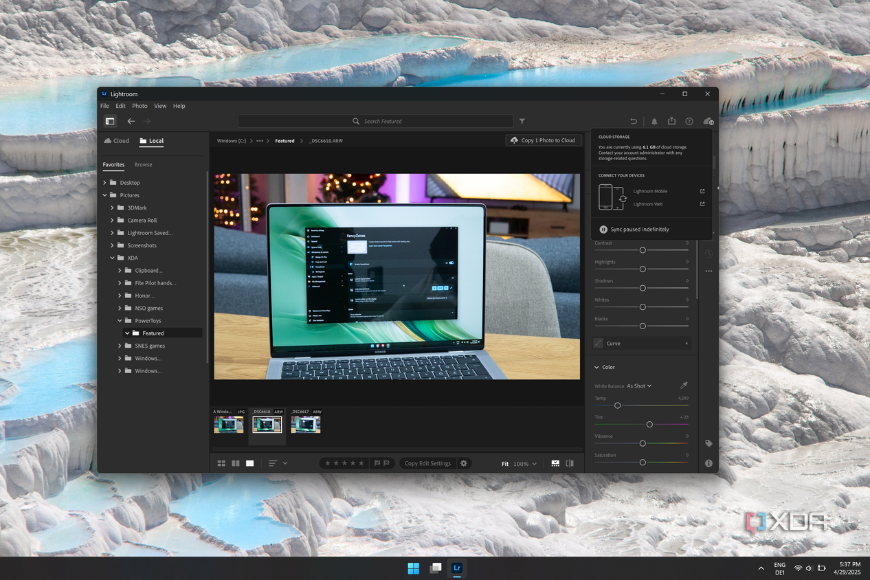 Screenshot of Adobe lightroom on Windows 11 with a menu showing that syncing is paused