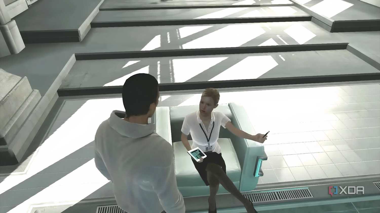 An image from the game Assassins' Creed, showing Desmond Miles talking to Lucy.